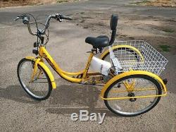 Yellow Electric tricycle 36 volts 450 watt. Rear wheel drive
